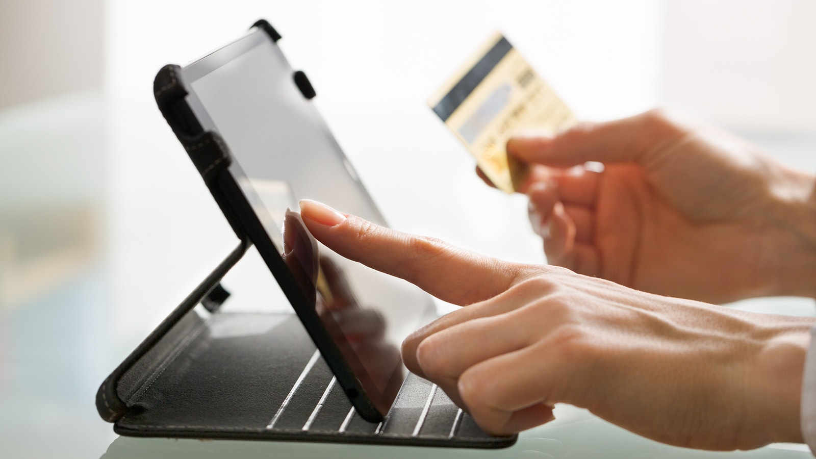 Image of a man making an online payment.